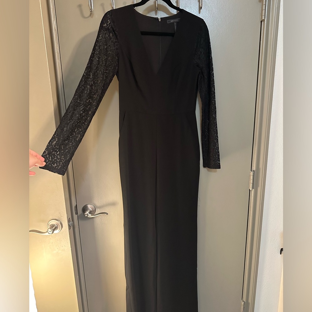 BCBGMaxzaria black long sleeve jumpsuit size 4.